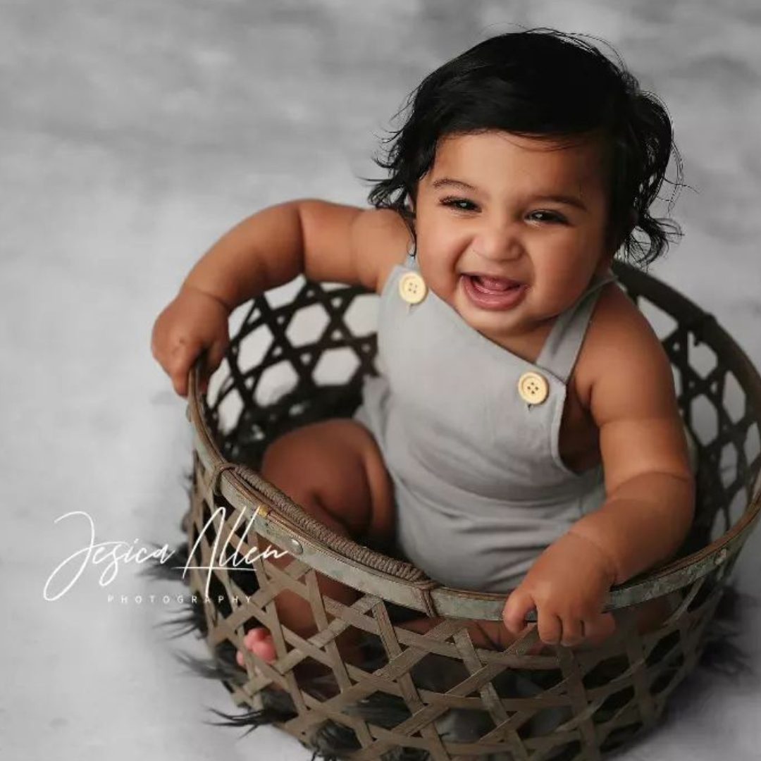 Smiling child in a basket