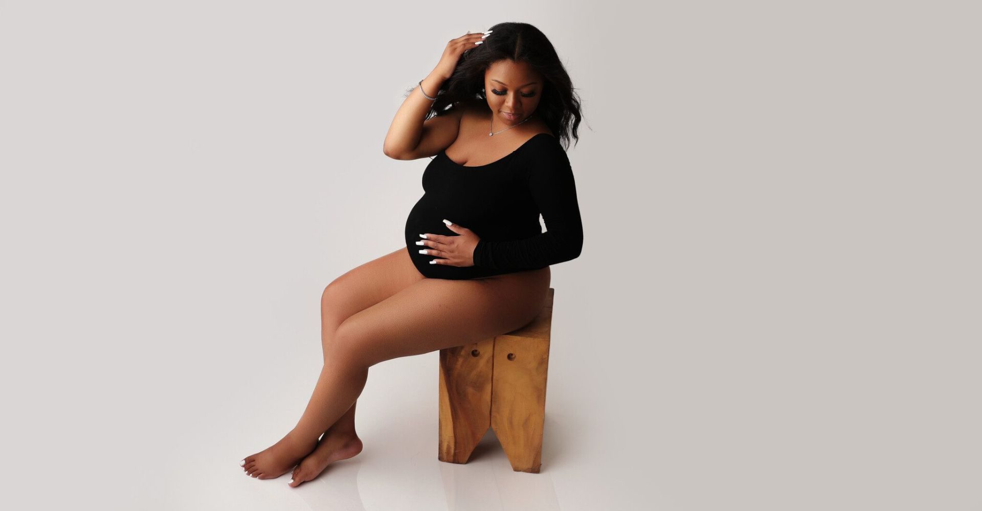 a woman who is pregnant posing for maternity photos